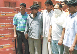 Four persons accused of looting terminal batteries in police custody in the Capital on Sunday.
