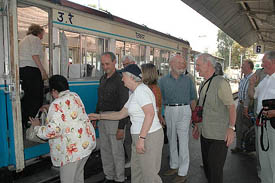 Foreign tourists board a rail motor car from Kalka railway station to Shimla on Saturday