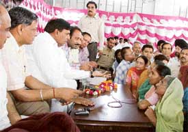 Mr Surinder Dawar, Parliamentary Secretary, Power and Housing, listens to public complaints at a khula darbar