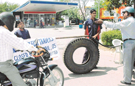 A customer argues with a petrol station worker during a strike called by the Federation of All India Petroleum Traders in Chandigarh on Monday.
