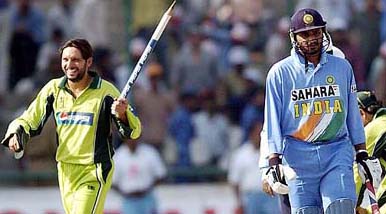 Shahid Afridi celebrates as Harbhajan Singh looks after Pakistan won the final match at Ferozeshah Kotla ground in New Delhi on Sunday