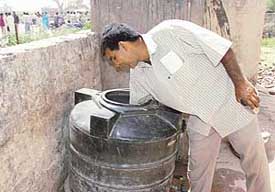 The water tank in Government Primary School, Rampur Seori, does not have a lid and waste, especially from nearby stone crushers