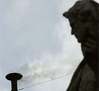 White smoke vents up from the chimney of the Sistine Chapel as cardinals elected German Joseph Ratzinger as pope at the Vatican City on Tuesday