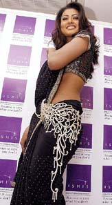 TV star Nigar Khan showcases a jewel-decorated waistband worth Rs 2 crore in Ahmedabad on Thursday.