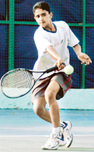 Mandeep Yadav of Chandigarh returns a shot during under-16 final match of AITA Talent Series at YPS, Mohali on Thursday. 