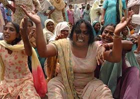 Relatives of Balbir Singh wail over his death outside the Civil Hospital, Kapurthala, after he died in police custody