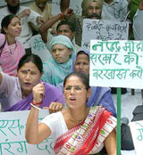 Activists of the Rashtriya Janata Dal demand the dismissal of Gujarat Chief Minister Narendra Modi for the attack on Railway Minister and RJD President Lalu Prasad Yadav at Jantar Mantar in New Delhi on Friday.