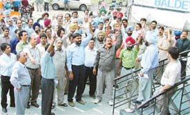 OBC staff members hold a rally in Ludhiana on Saturday