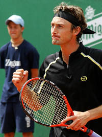 Spain's Juan Carlos Ferrero celebrates after his victory over Russia's Nikolay Davydenko during a semi-final match at the Barcelona Open in Spain on Saturday