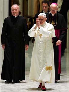 Pope Benedict XVI enters the Vatican hall, used for weekly general audiences, for a meeting with journalists on Saturday