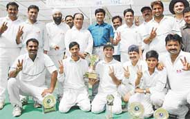 Winning team members of the Elite Cricket Club in jubilant mood after winning the first Bachitter Singh Rana Memorial Cricket Tournament held at the ITI grounds, Sector 28, Chandigarh