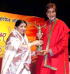 Melody queen Lata Mangeshkar felicitates Bollywood megastar Amitabh Bachchan for his outstanding performance as an actor at the annual Dinanath Mangeshkar Memorial Awards function in Mumbai on Sunday