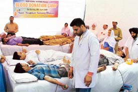 Volunteers donate blood at a blood donation camp organised by the Sant Nirankari Mandal in Ludhiana on Sunday