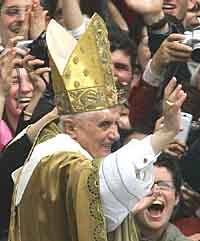 Pope Benedict XVI waves to the crowds after his inaugural mass in St Peters Square in Vatican City on Sunday.