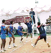 A Calcutta player making a ball while his colleague prepares to execute a shot against Haryana in the quaterfinal match of the All-India Electricity Boards Volleyball Tourmanet in Panchkula on Monday.
