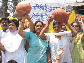 BJP activists protesting against the shortage of water in the Capital