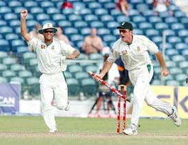 South Africas Jacques Kallis  and captain Graeme Smith celebrate after beating the West Indies on the fourth day of the third Test at Kensington Oval in Bridgetown