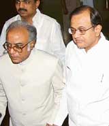 Mr Asim Das Gupta, Finance Minister of West Bengal and Chairman of the Empowered Committee on VAT, with Union Finance Minister P. Chidambaram on the way to attend the state ministers meeting on Vat in New Delhi on Tuesday.