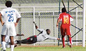 JCT goalkeeper Mansuru Mohammed dives in vain to prevent the ball from entering the net after Ranty Martins of Dempo SC capitalised on a free kick in a ninth National Football League match in Ludhiana