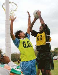 Pakistan goal striker attempts to score a goal while Indian defender jumps to save it at V Indo-Pak Netball match in Sector 17, Chandigarh