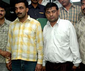 The two accused in the job racket in police custody