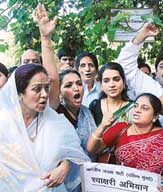 BJP activists hold a demonstration outside the Church Gate station, Mumbai, on Thursday against the rape of a teenager by a policeman at Marine Drive. 