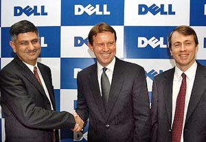 Dell Inc. President & CEO Kevin Rollins (centre) shakes hands with Romi Malhotra (left), Managing Director, Dell India, during his first visit to India at Bangalore on Friday.