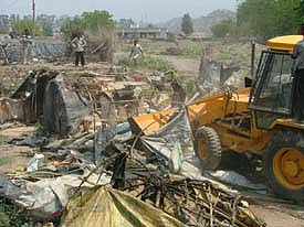 Demolition drive in progress at Sector 3, Panchkula, on Friday. 