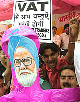 Traders with an effigy of Prime Minister Manmohan Singh demonstrate against VAT at Jantar Mantar in New Delhi on Friday.
