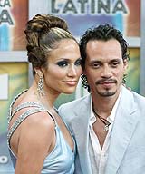 Actress/singer Jennifer Lopez and husband/singer Marc Anthony arrive at the Latin Billboard Awards