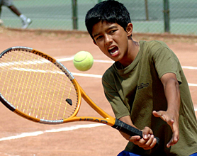 Akshat Joshi of Chandigarh returns a shot against Karamvir Singh of Calcutta during AITA Super Series Tennis Tournament at CLTA on Saturday.