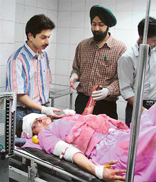 Asha, one of the injured in a bus accident near Khanna, being given medical aid on Saturday