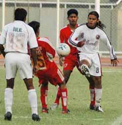 Mohun Bagans Noel Wilson tries to gain possession of the ball as team-mate Dulal Biswas (left) looks on, in a National Football League match against JCT Mills at Ludhianas Guru Nanak Stadium on Saturday