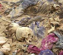 Human skulls and clothes are seen at a mass grave discovered in al-Samawa desert at Muthanna province, 270 km south of Baghdad, on April 25. 