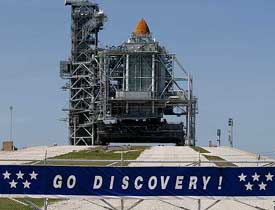 Space Shuttle Discovery sits on the launch pad
