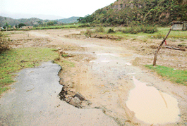 A section of link road between Chandigarh and Pinjore, washed away by a seasonal rivulet at Tanda village near Nayagoan.