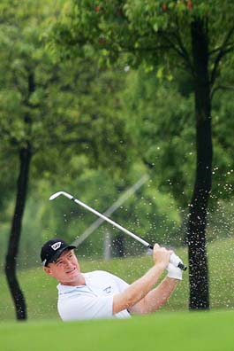 Ernie Els watches his shot during the final round of the Asian Open golf tournament in Shanghai on Sunday.