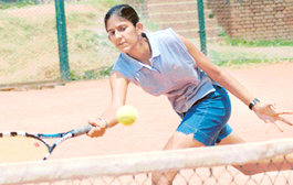 Sampada of Maharashtra plays a shot against Sanjana Kapoor of Delhi during under-18 AITA super series Tennis Tournament at CLTA, Chandigarh on Monday. Photo Pradeep Tiwari