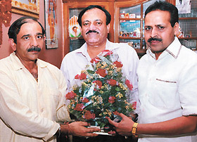 DPCC president Ram Babu Sharma being felicitated by C. K. Khanna, secretary, Chand Khanna Club, and vice-president Vinod Garg
