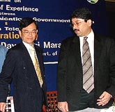 Minister of Communications and Information Technology Dayanidhi Maran poses with Allen Ma, President, British Telecom Global Services, at a seminar in New Delhi on Tuesday. The minister said the country is poised to provide for reforms so as to facilitate convergence of both market and technologies in developing a world class telecom infrastructure.