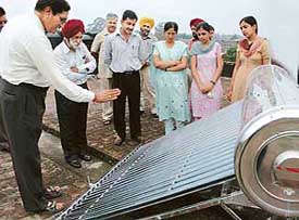 Prof S.K. Sharma explains functioning of a Solar equipment on the Solar Day Celebration at Panjab University