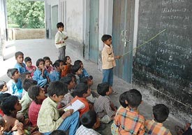 A student takes a class at Government School in Teora in the absence of teachers in Kurukshetra district