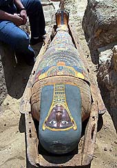 A 2,300-year-old mummy is displayed after it was found by the Sakkara Pyramids