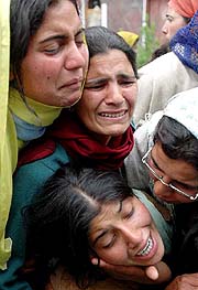 Wailing relatives mourn the death of Mohammad Ramzan Mian