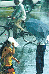 Delhiites were caught in the sudden downpour that brought down the temperature in the Capital on Wednesday