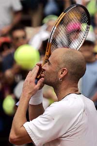 US tennis star Andre Agassi blows kisses following his victory over Richard Gasquet of France at the Rome Masters tennis tournament in Rome on Wednesday
