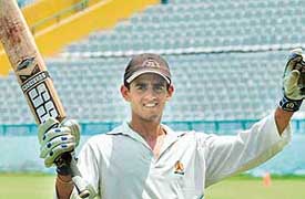 Anupam Gambhir of Chandigarh after completing his century against Ludhiana in Under-17 inter-district M. L. Markan Cricket Trophy at the PCA grounds, Mohali