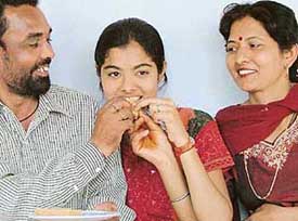 Pooja Saini of New India Senior Secondary School, Panchkula, who topped in Panchkula district with 84 per cent marks in matriculation with her parents