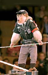 A monkey dressed in a costume, representing Nazi Germany's military uniform, performs during a show at a circus in Yekaterinburg 