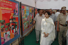 Union Minister Kumari Selja looks at an exhibition at a health fair in Naggal on Friday
